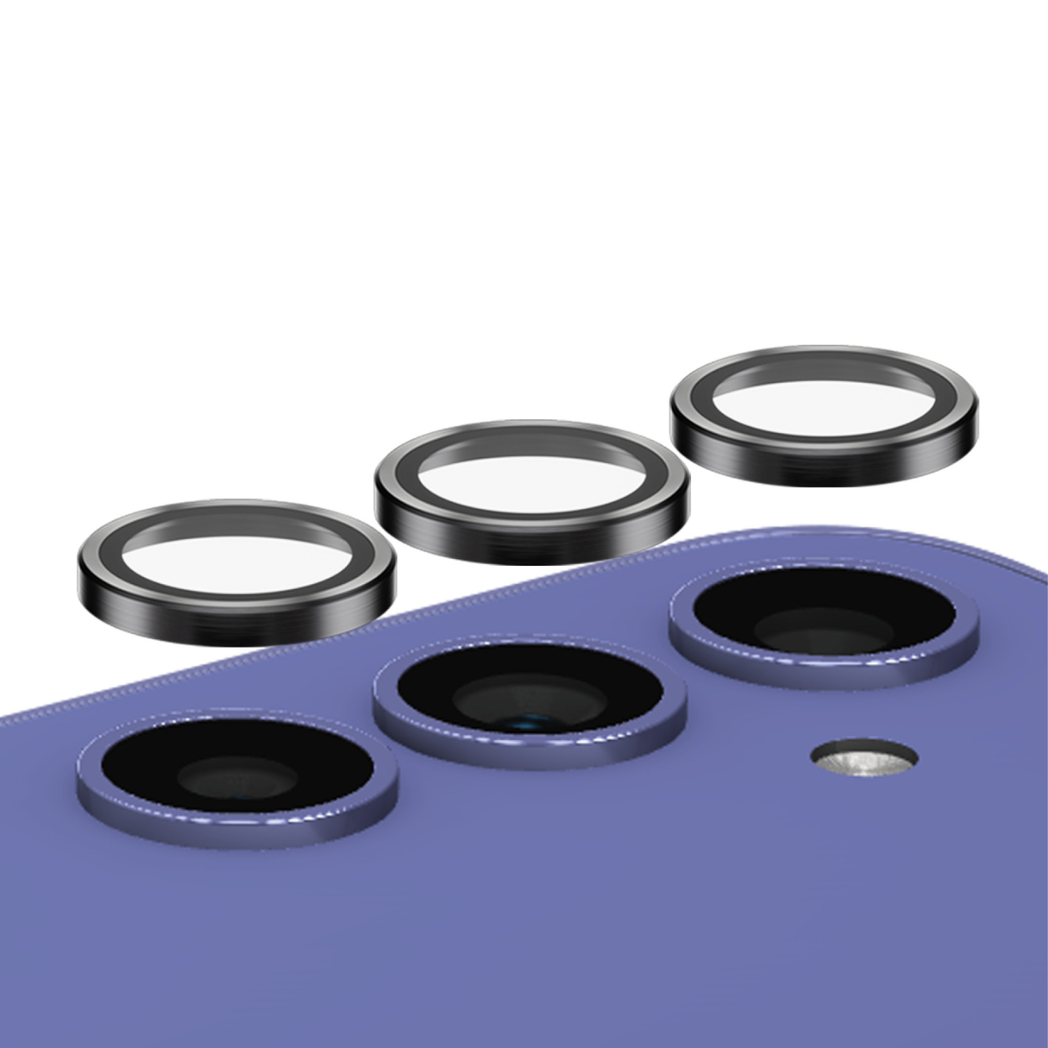Drie zwarte lensbeschermers. Donkere metalen ringen met heldere centers. Geplaatst boven een paarse telefoon.