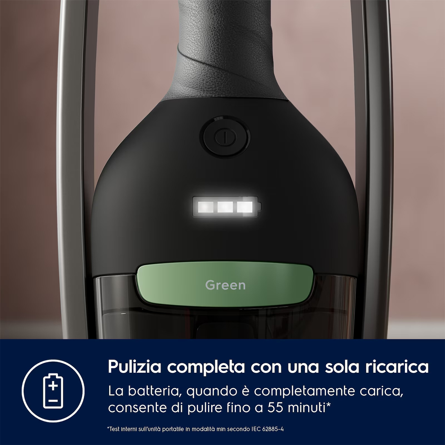 Aspirapolvere nero e verde con indicatore livello batteria bianco e pulsante verde.