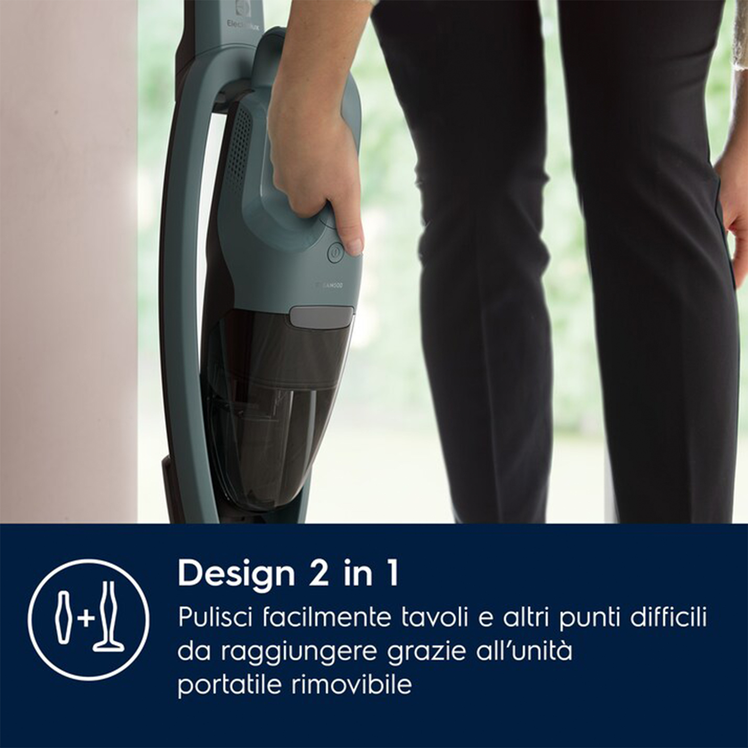 Persona che tiene un aspirapolvere verde e nero. Il testo dice Design 2 in 1.