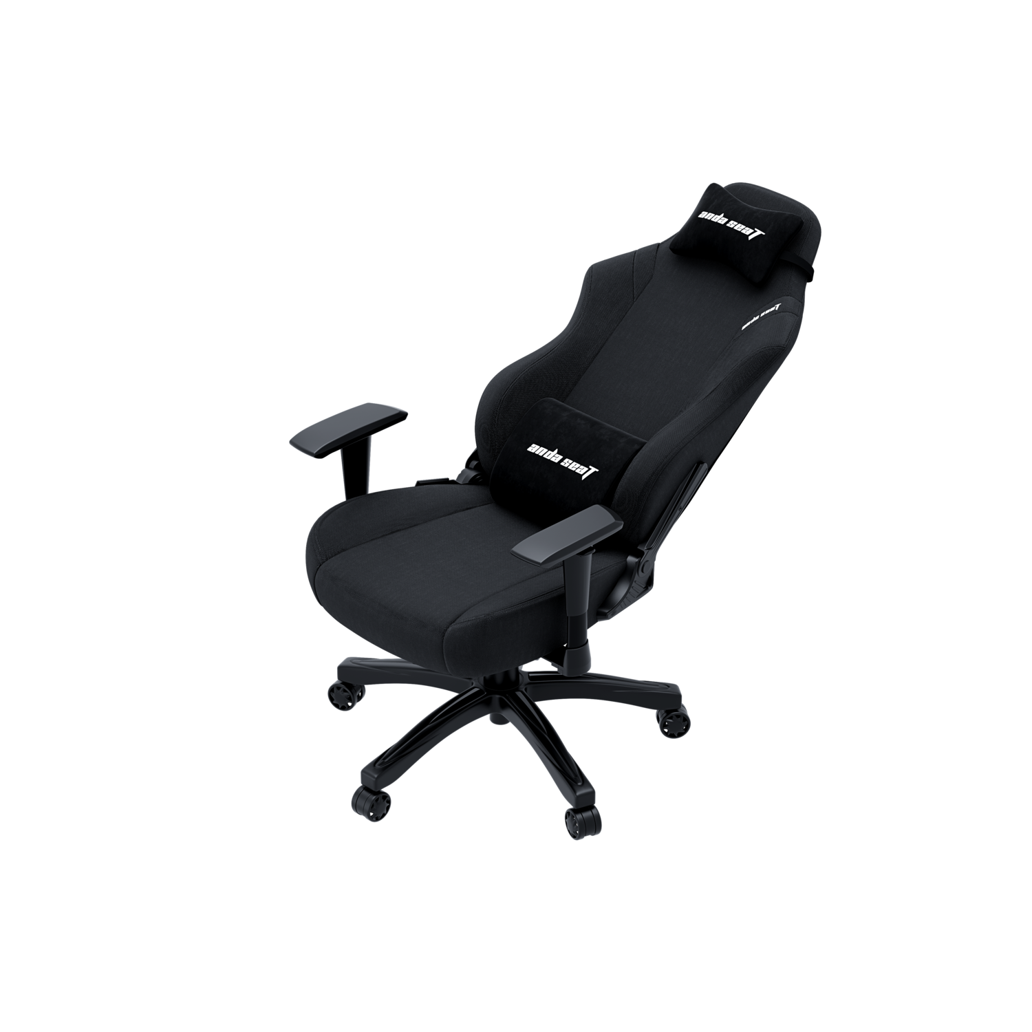 A black gaming chair with a black headrest and lumbar pillow. Black background.