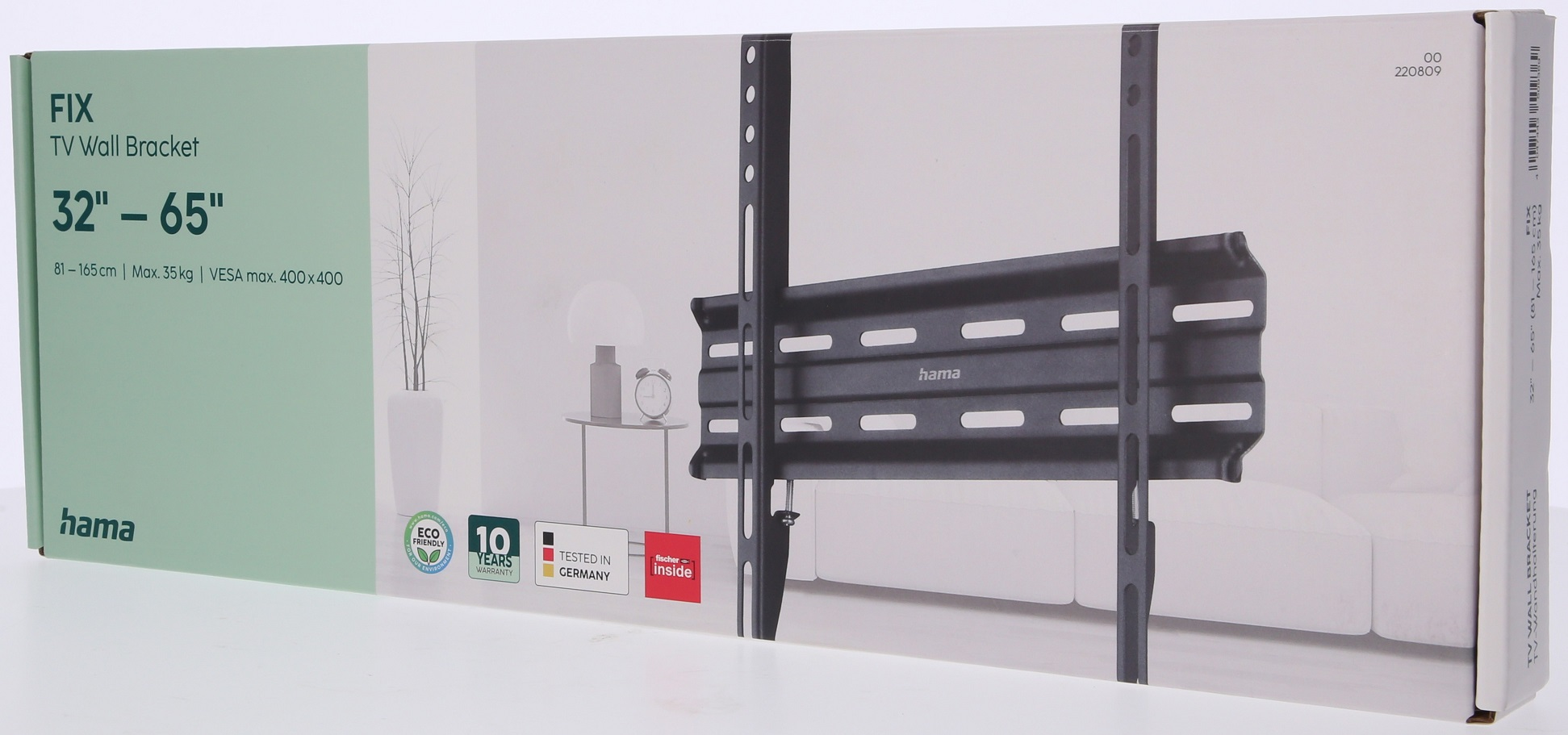 Pudełko z uchwytem ściennym do telewizora. Pudełko jest białe z czarnym tekstem, a uchwyt widoczny.