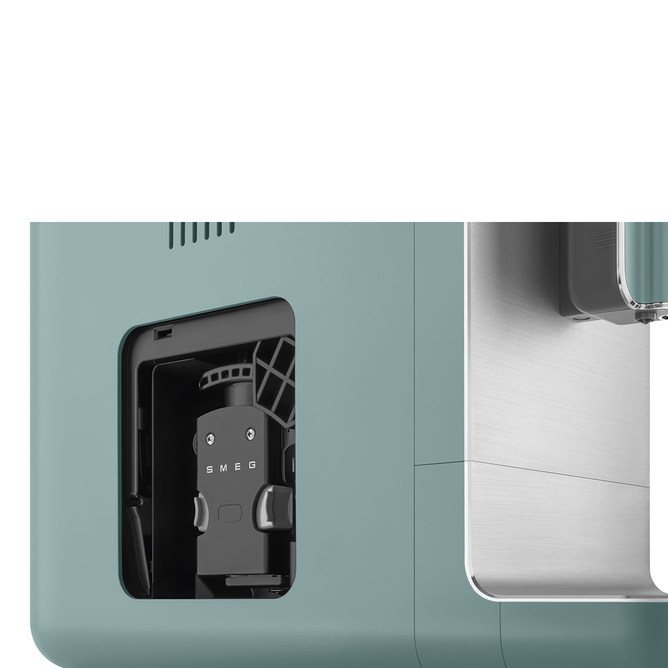 Nahaufnahme des Inneren einer Smeg-Kaffeemaschine. Die Maschine ist türkis mit silbernen Akzenten.