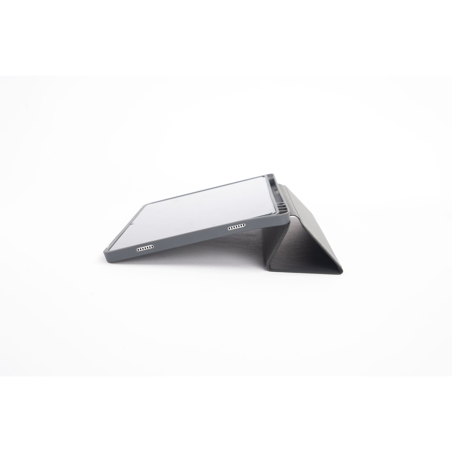 Tablet with a gray case propped up at an angle against a gray cover on a white surface.