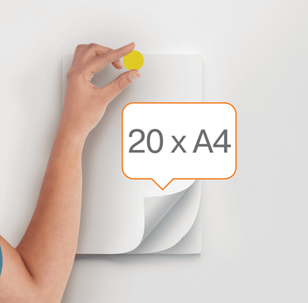 Kéz sárga kerek mágnest tart fehér papírhoz, a '20 x A4' szöveggel.