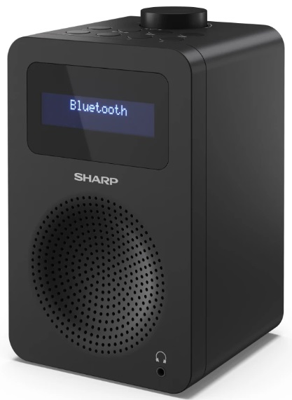 Czarny głośnik w kształcie kostki z wyświetlaczem 'Bluetooth' i okrągłą kratką głośnika.