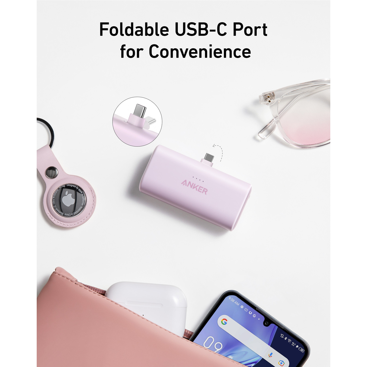 Batterie externe Anker avec port USB-C, téléphone, lunettes et autres accessoires.