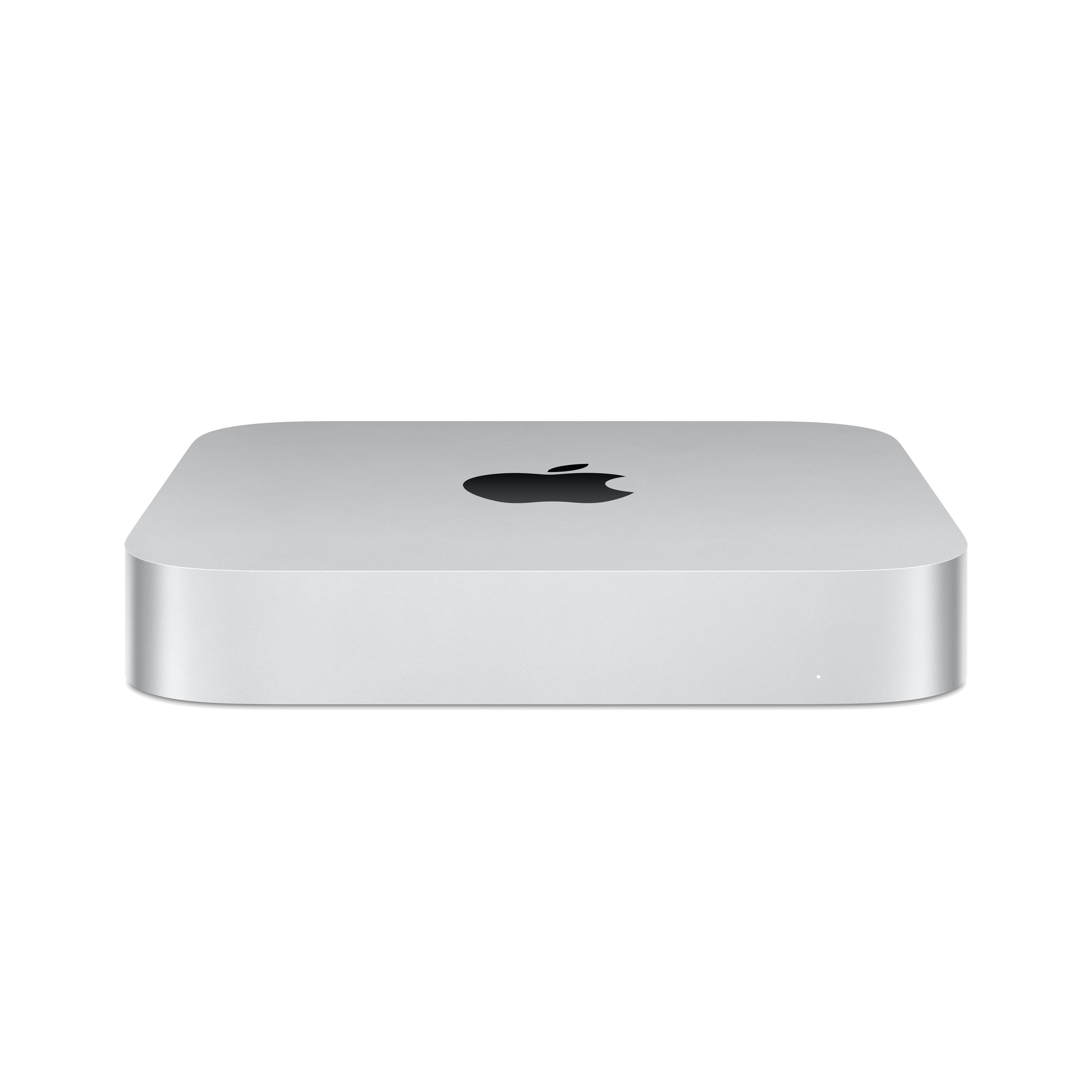 Un ordenador Mac Mini plateado sobre un fondo negro, con el logotipo de Apple en la parte superior.