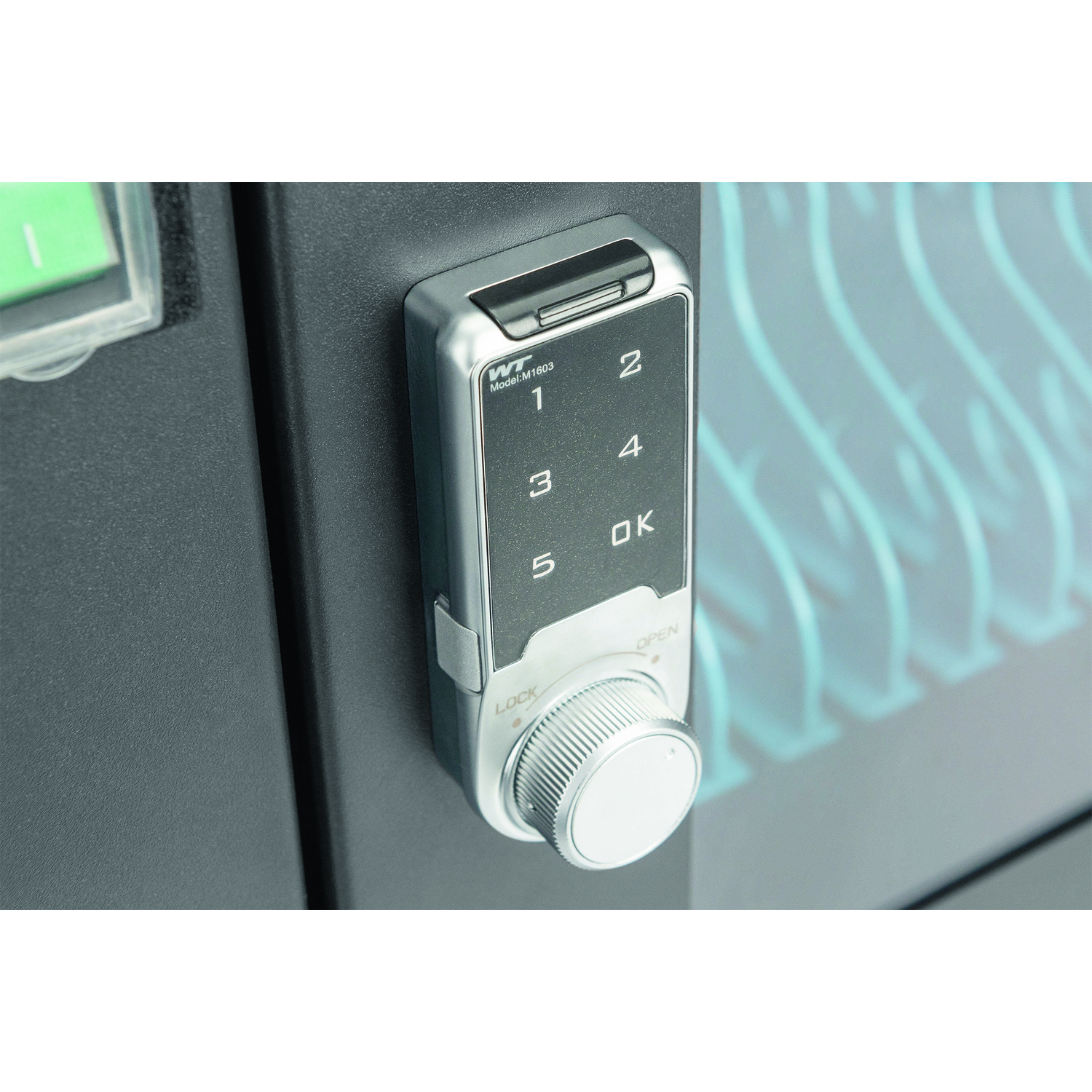 A silver digital safe lock with a numeric keypad and a dial.