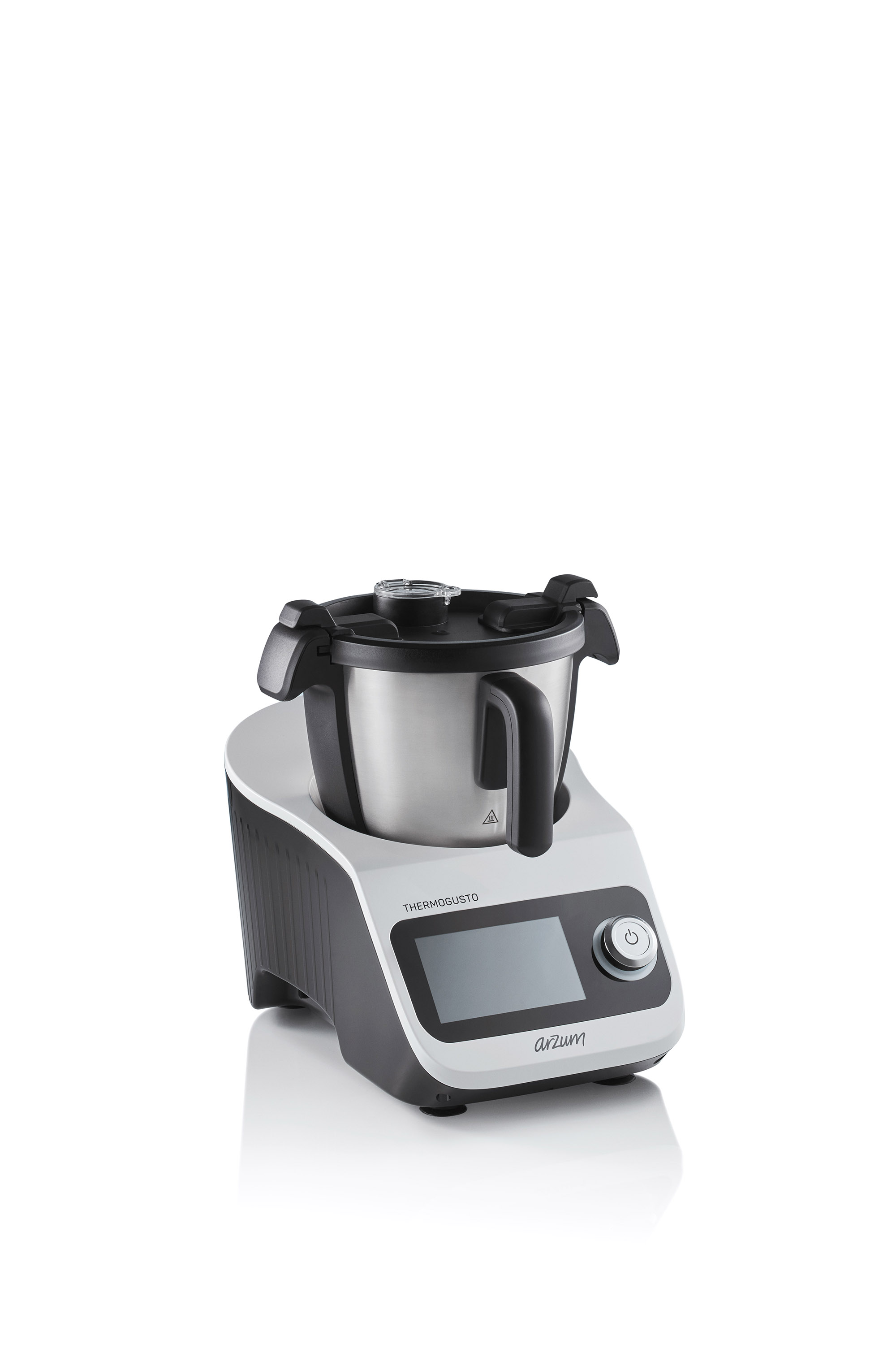 Beyaz ve siyah bir Thermomix mutfak robotu. Beyaz bir yüzey üzerinde beyaz bir arka plana karşı duruyor.