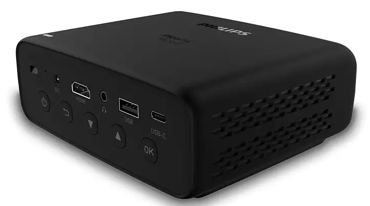 Czarny projektor Philips z różnymi portami i przyciskami po bokach, widok z góry.