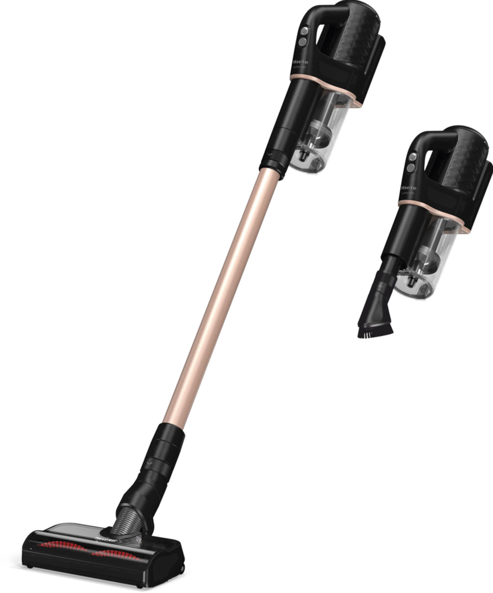 Czarny i różowo-złoty odkurzacz pionowy oraz odłączany odkurzacz ręczny na białym tle.