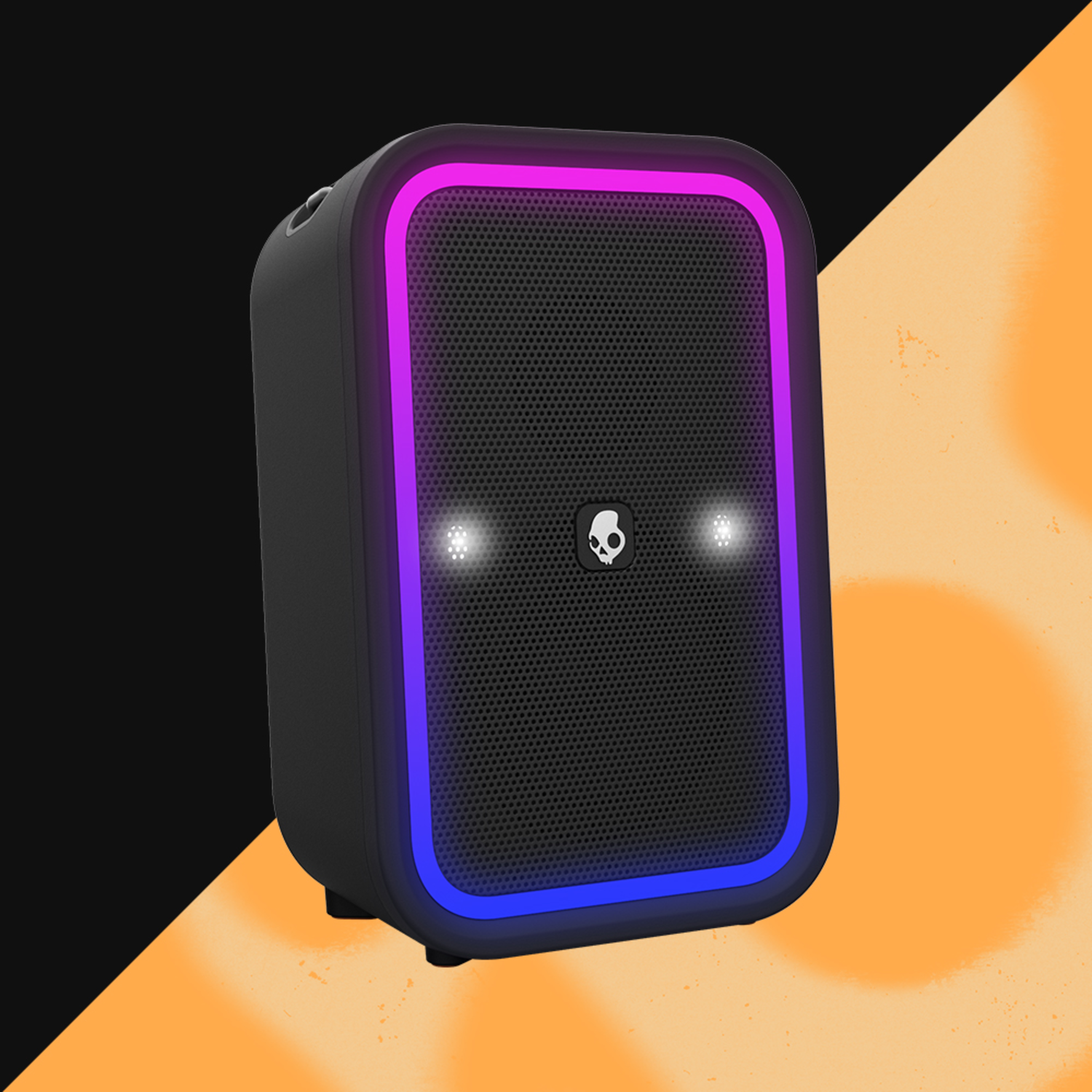Black speaker with a color-changing frame and skull logo, orange and black background.