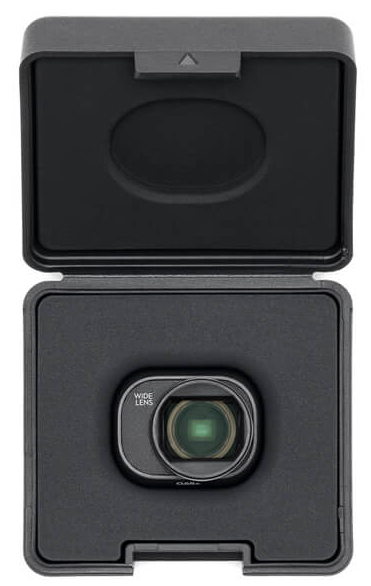 Czarne pudełko z akcesoriami do aparatu z obiektywem i akcesoriami, widok z góry.