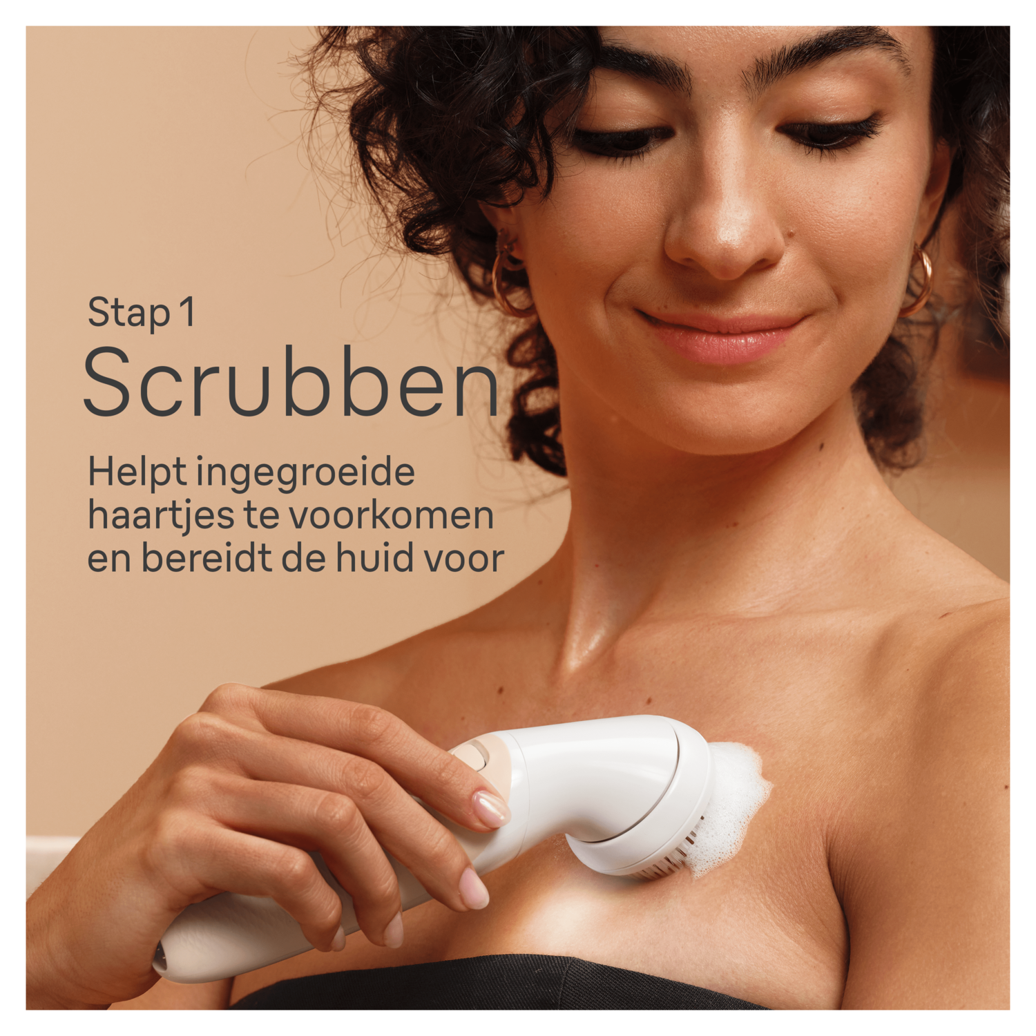 Woman using a facial brush, text says: Scrubben, helps prevent ingrown hairs.
