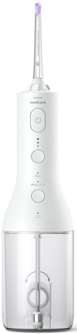 White electric toothbrush with buttons and a clear water reservoir.