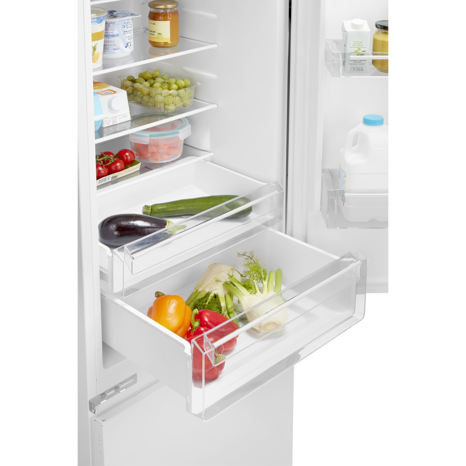 A refrigerator interior with drawers filled with vegetables and fruits.