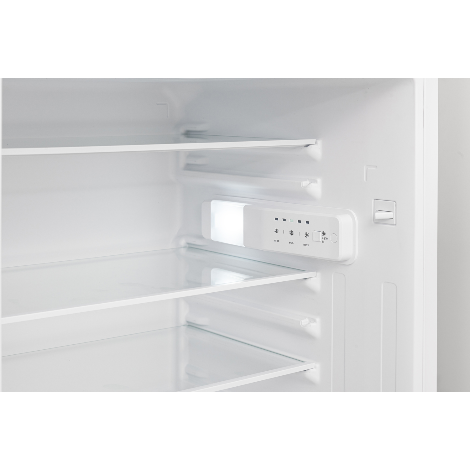 Inside of a refrigerator. Shelves and a light panel are visible. White interior.