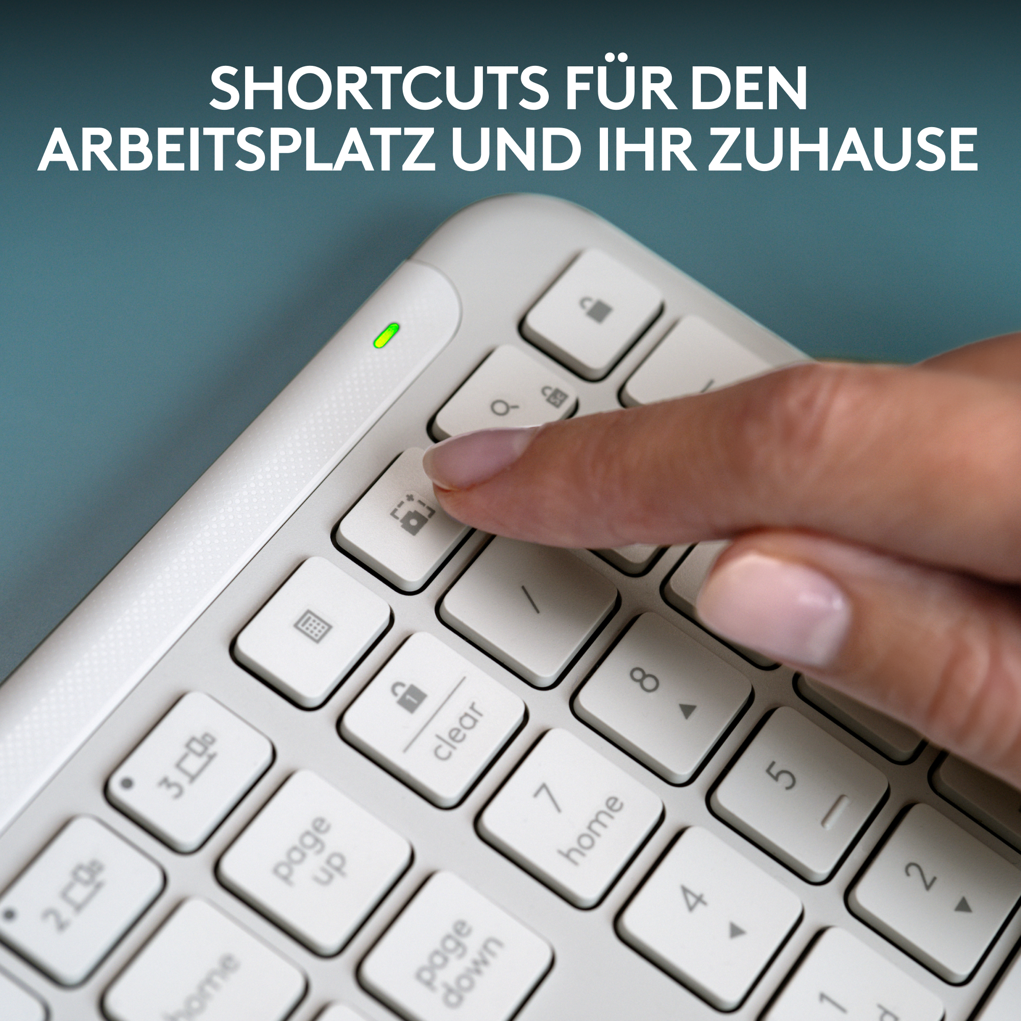Ein Finger drückt eine Sperrtaste auf einer weißen Tastatur. Text über der Tastatur.