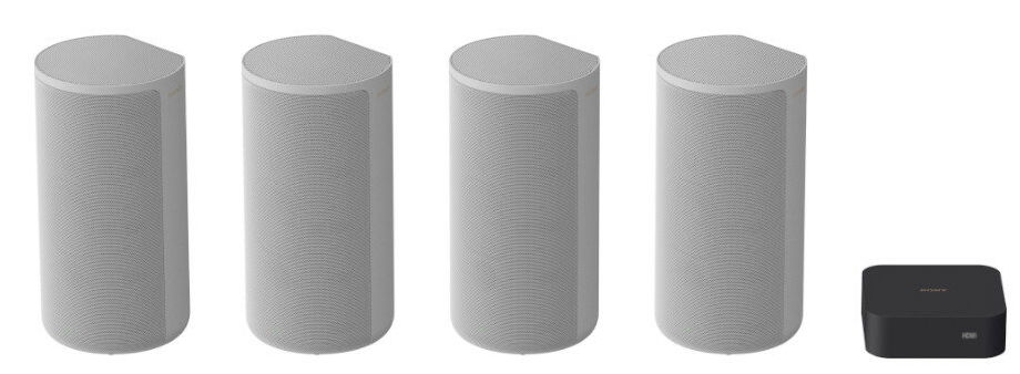 Zestaw czterech białych głośników cylindrycznych Sony i czarne pudełko systemu rozrywki Sony.
