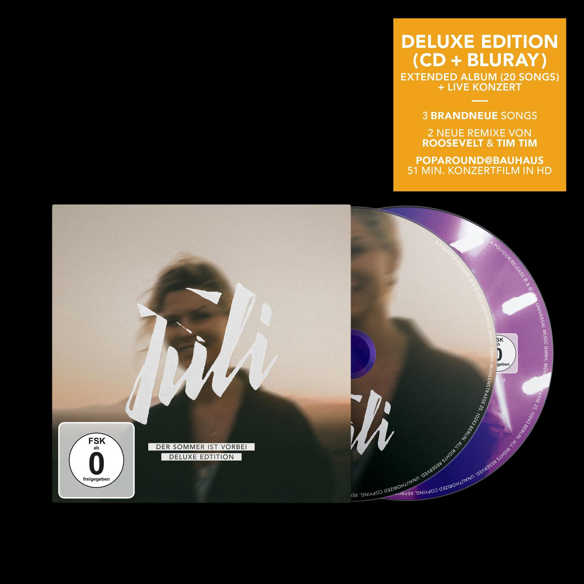 Deluxe Edition CD+Blu-ray mit Frau im Vordergrund und gelbem Kasten.