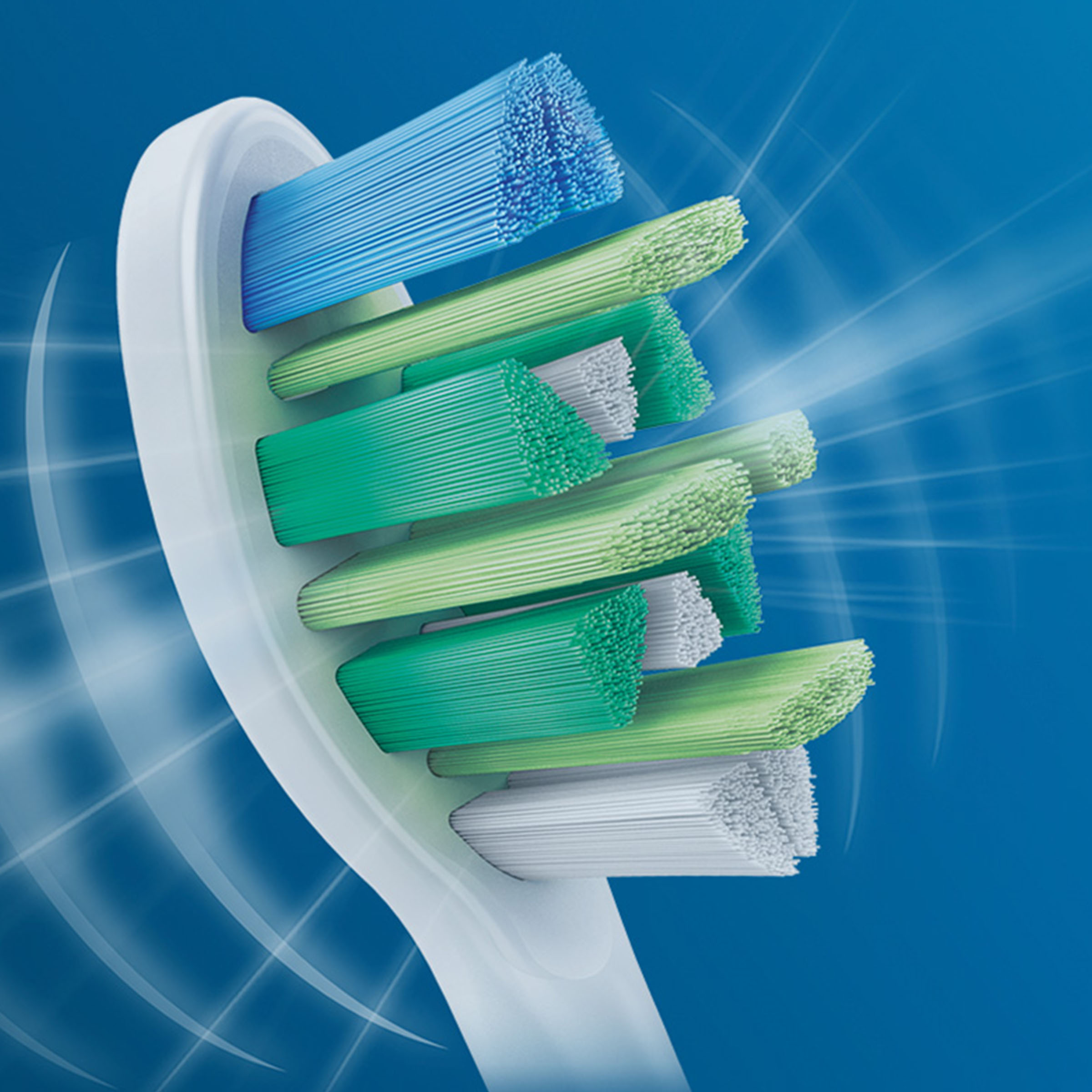 Zbliżenie główki szczoteczki do zębów z kolorowym włosiem, niebieskim i zielonym.