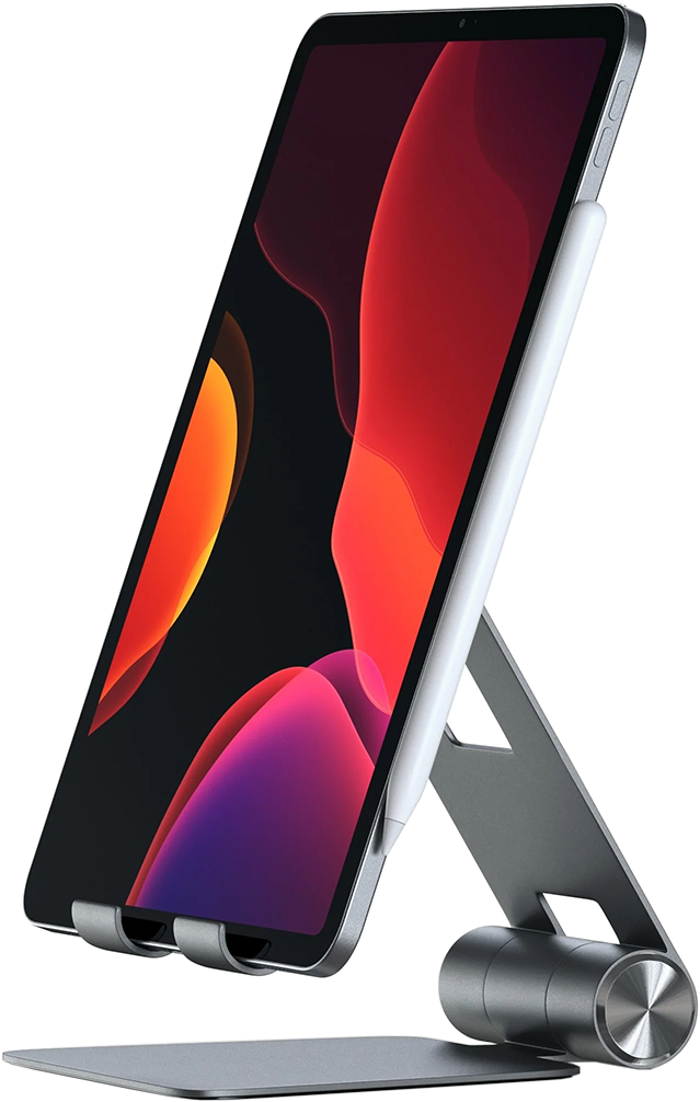 Tablet állványon, látható piros és rózsaszín képernyővel, fekete háttérrel.