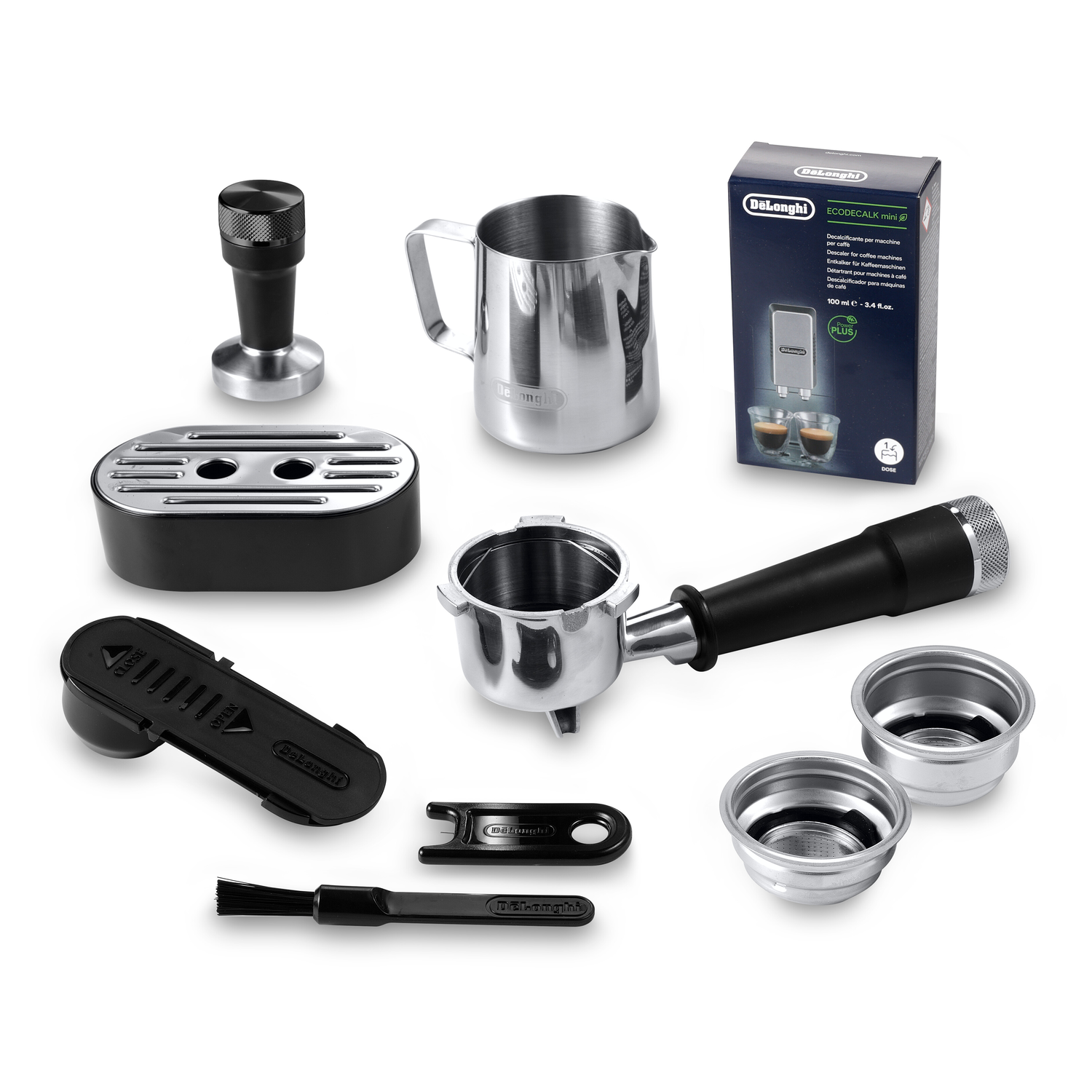 Espresso machine accessories, including a portafilter and a tamper.