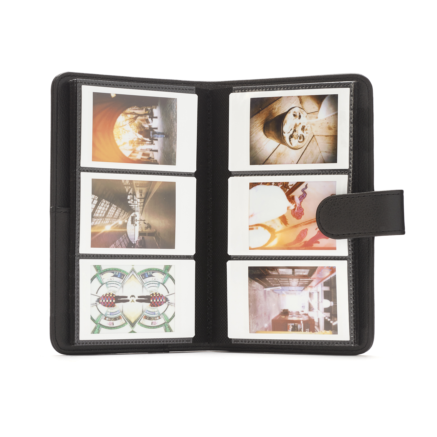 Black photo album open to show six photos.
