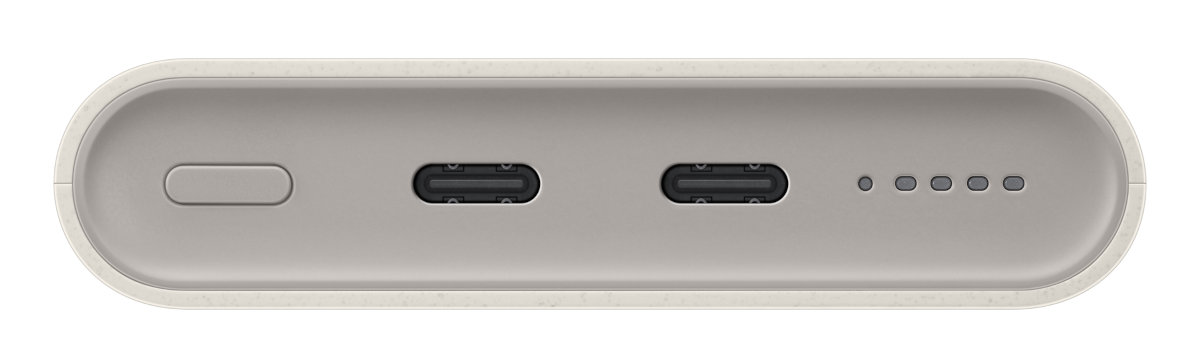 Power bank z dwoma portami USB-C i przyciskiem. Widocznych jest kilka małych kropek.
