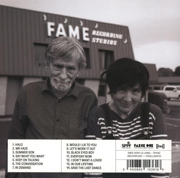 Albumcover mit zwei Personen. Einer mit Brille und der andere mit gestreiftem Hemd.