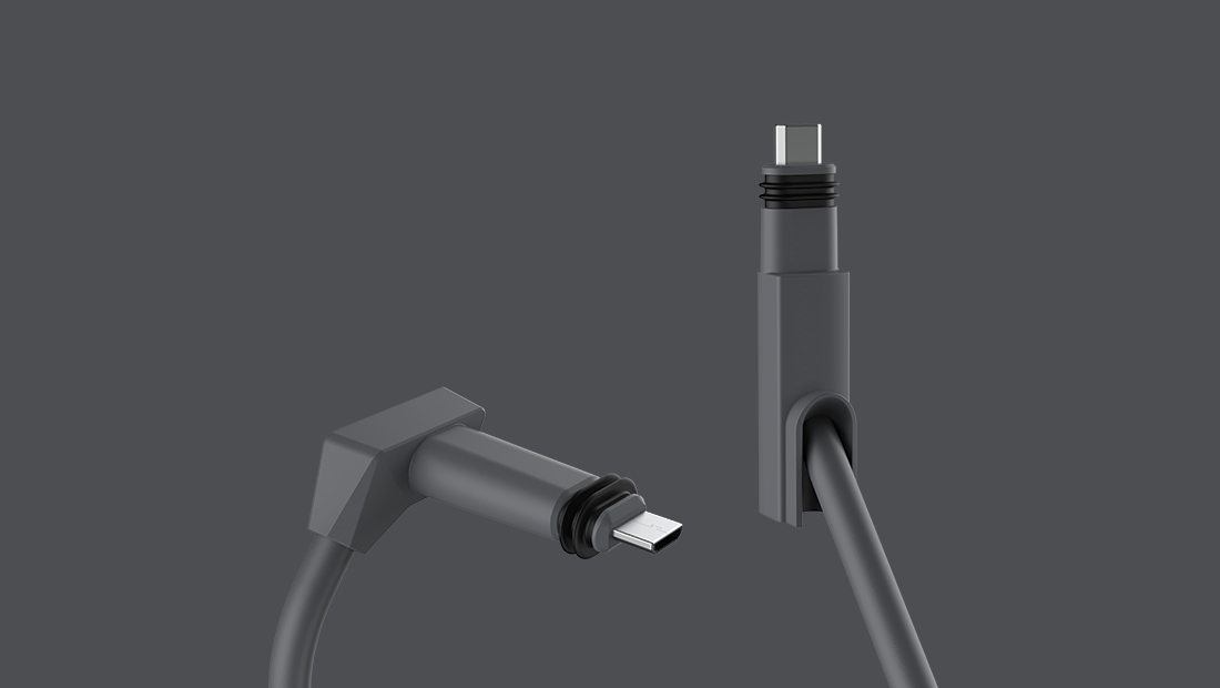 Zwei graue USB-C-Kabel auf grauem Hintergrund.