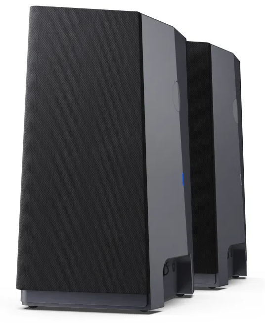 Trzy wysokie, czarne głośniki. Są cylindryczne i stoją pionowo.