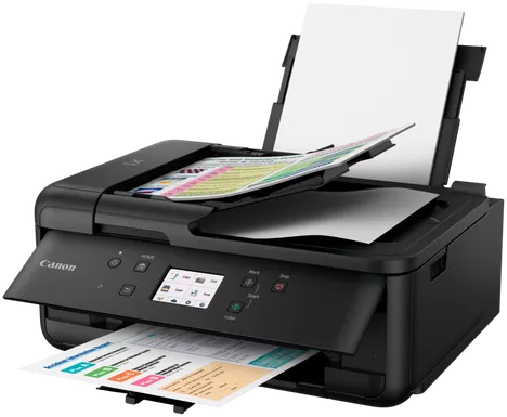 Schwarzer Canon-Drucker, Papierschächte und Druckausgaben sichtbar.