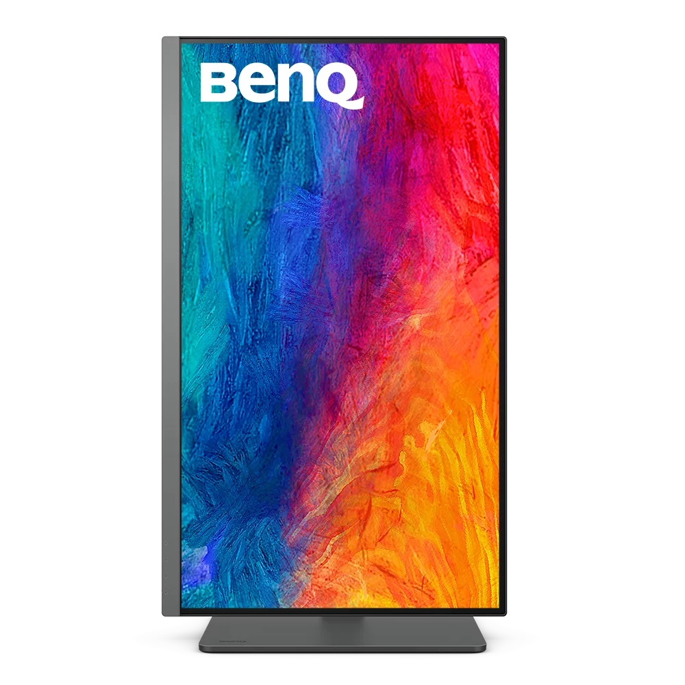 Un monitor BenQ muestra una imagen abstracta vibrante sobre un fondo negro.