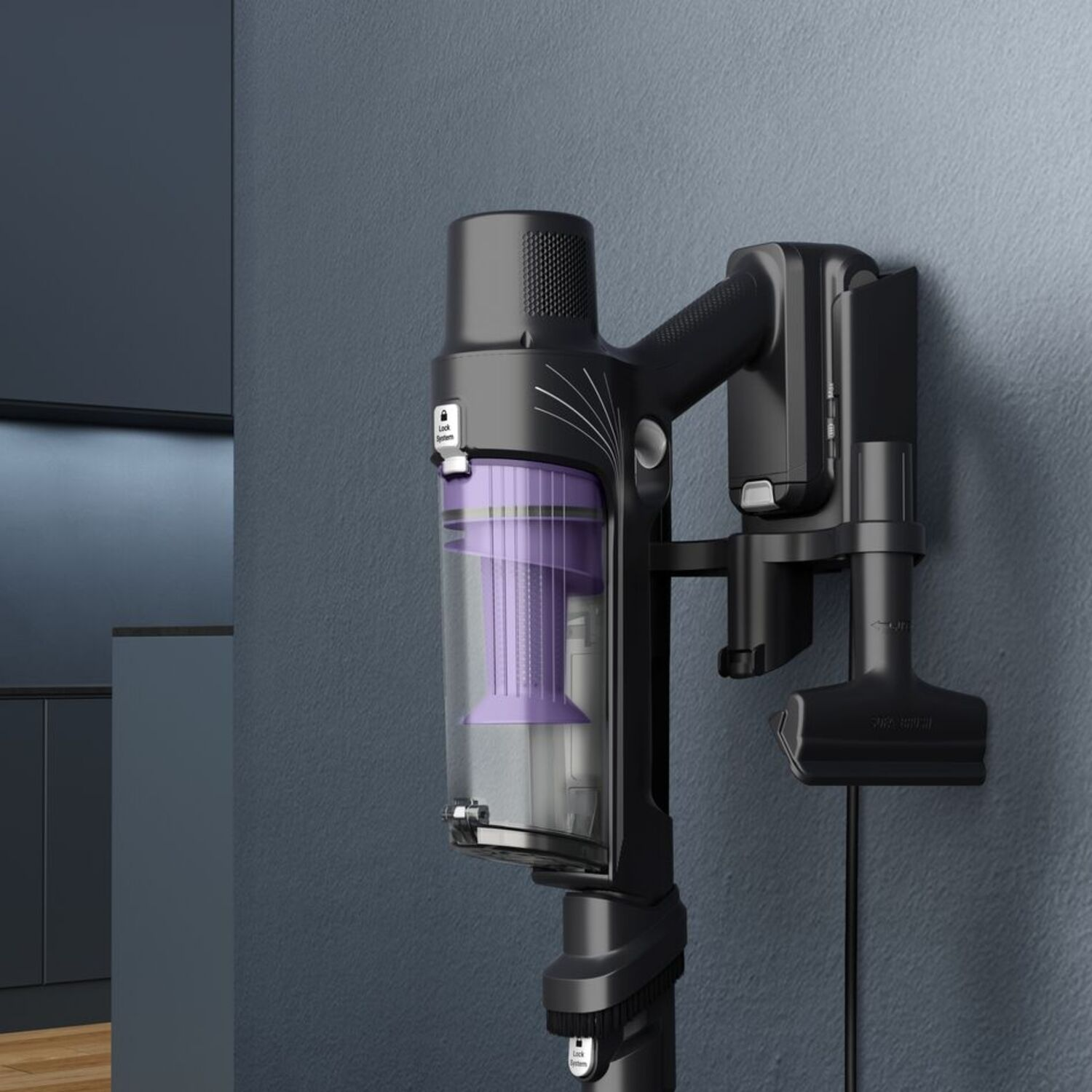 Black and purple cordless vacuum cleaner mounted on a wall.  A hose is attached.