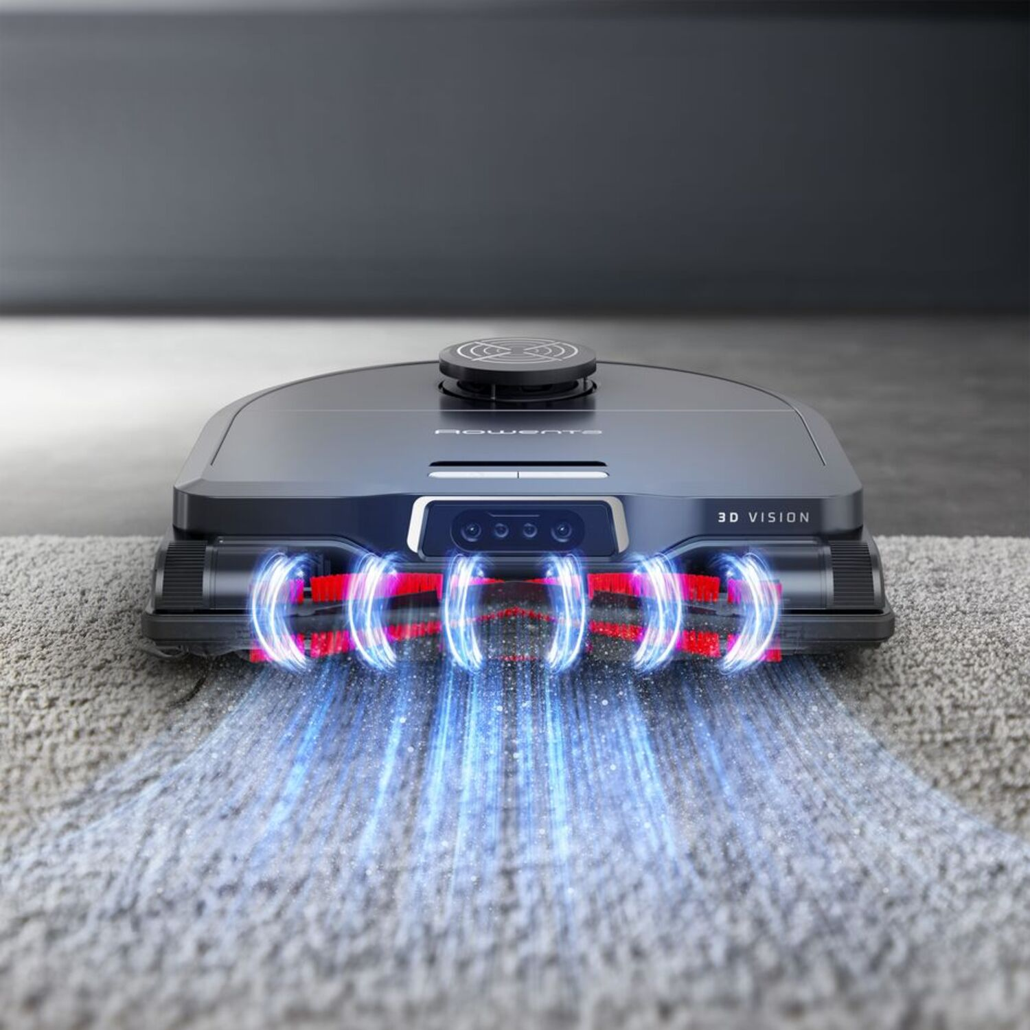A black robot vacuum cleaner on a rug. Blue lights emanate from the bottom, and on its front.