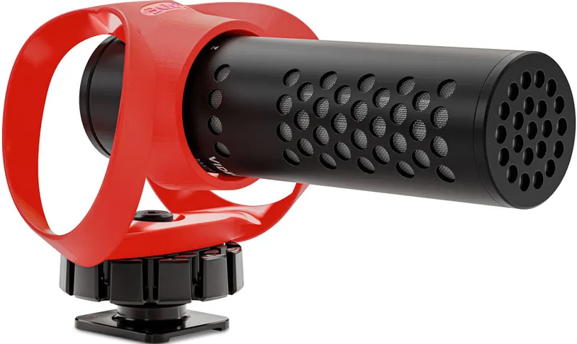 Une suspension antichoc rouge pour micro tenant un cylindre de micro noir.