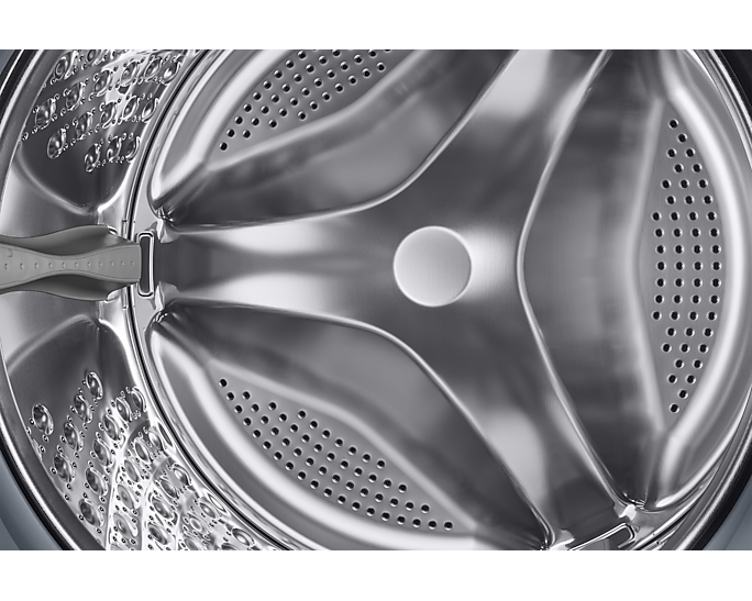 Mosógép dobjának belseje, fényes fém, három kiemelkedő résszel és perforációkkal.