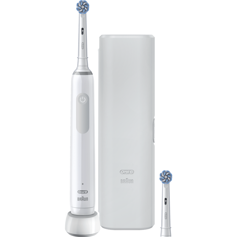 Cepillo de dientes eléctrico blanco, base de carga y un cabezal de cepillo extra sobre superficie blanca.