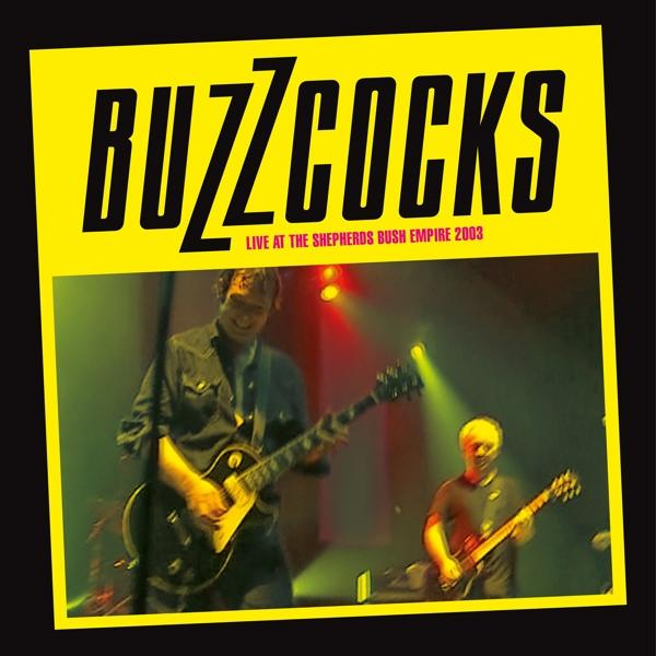 Albumcover: Buzzcocks live auf der Bühne mit Bandmitgliedern und gelbem Hintergrund.