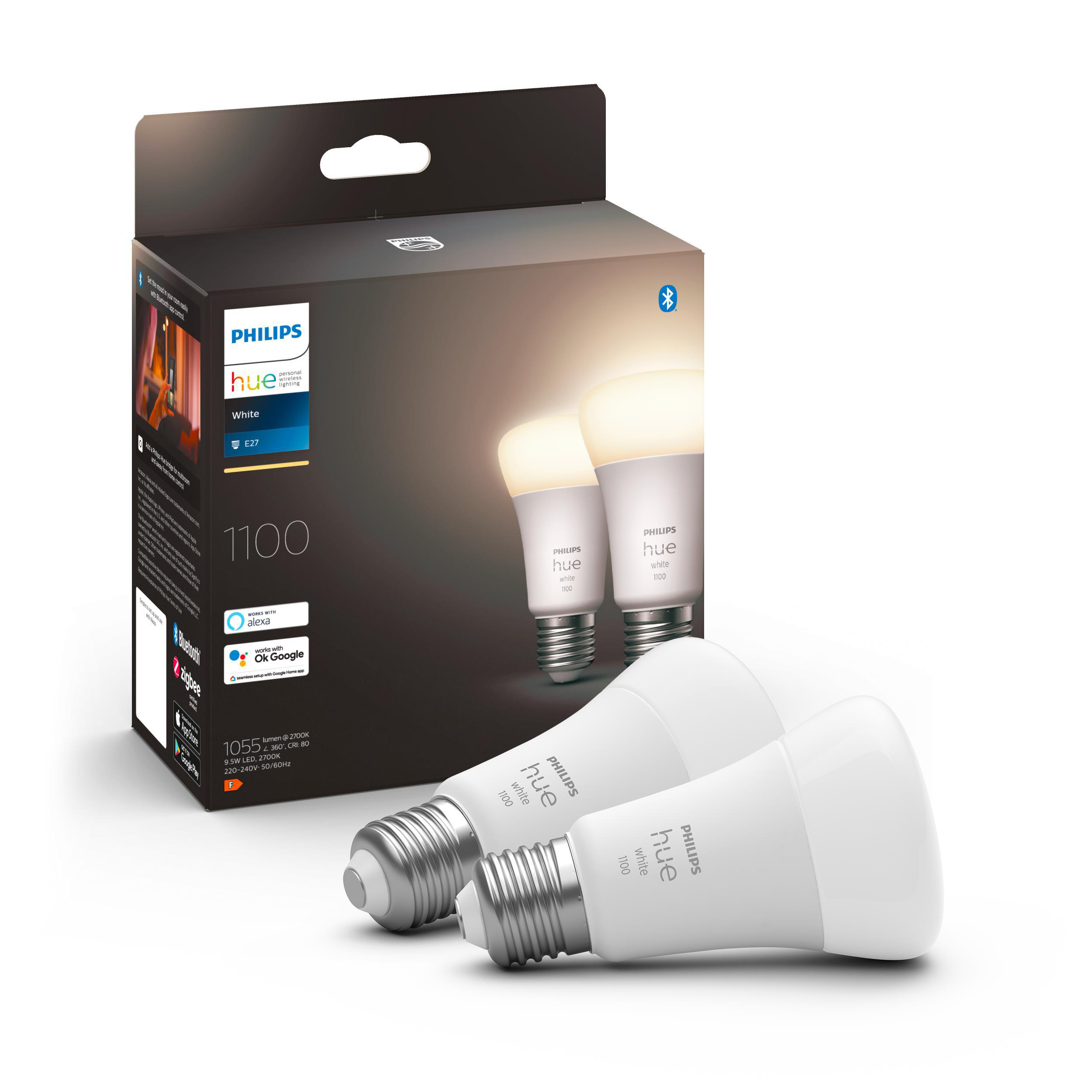 Zwei Philips Hue Smart-Glühbirnen und ihre Box auf weißem Hintergrund.