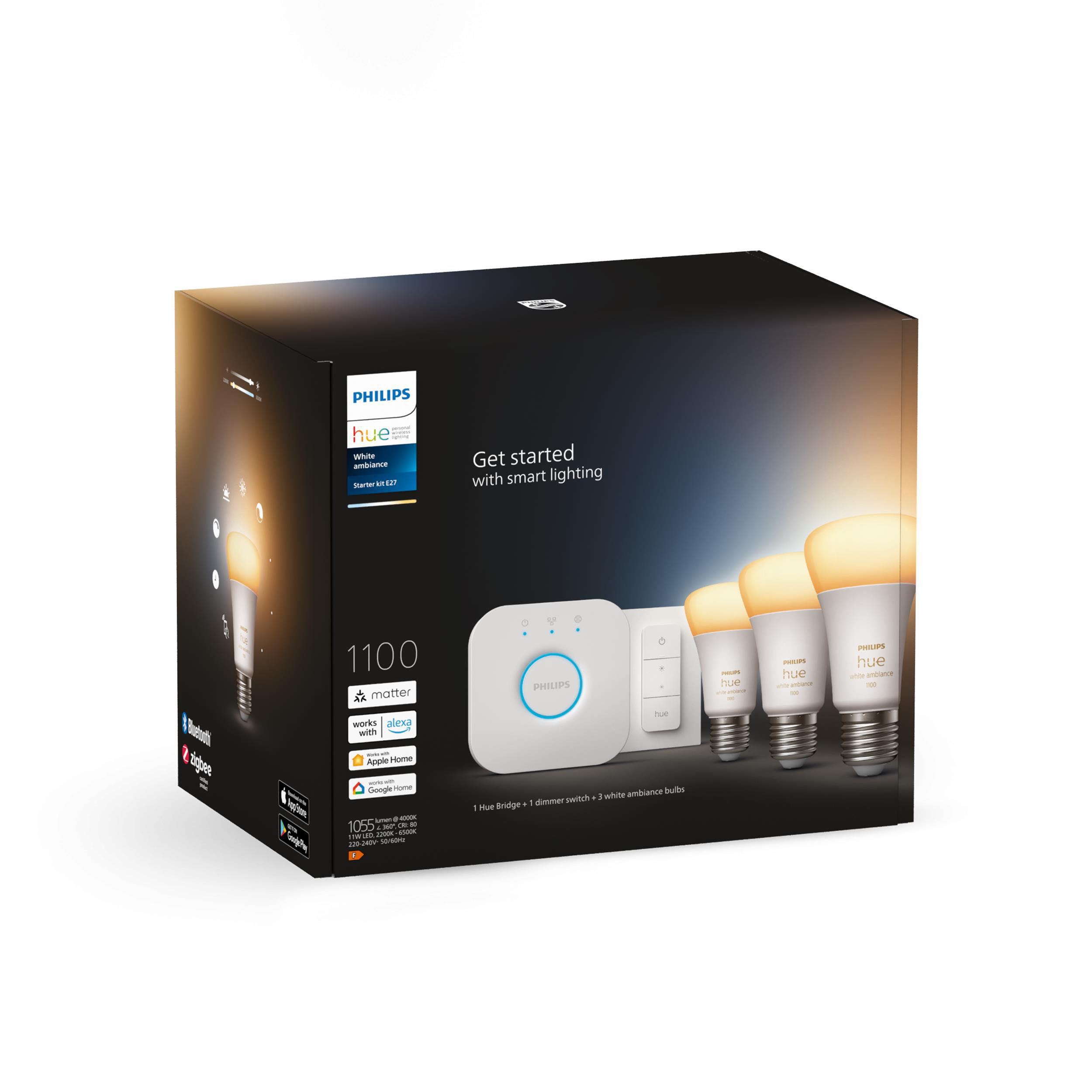 Box mit Philips Hue-Leuchten, Bridge und Dimmer, weißer Hintergrund.