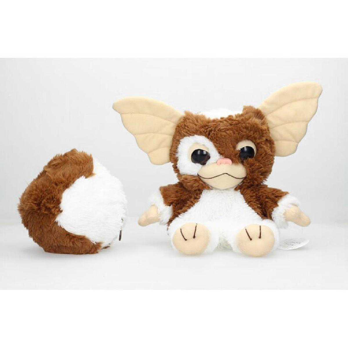 Gremlin-Plüschtier mit braun-weißem Fell. Es hat große Ohren und sitzt.