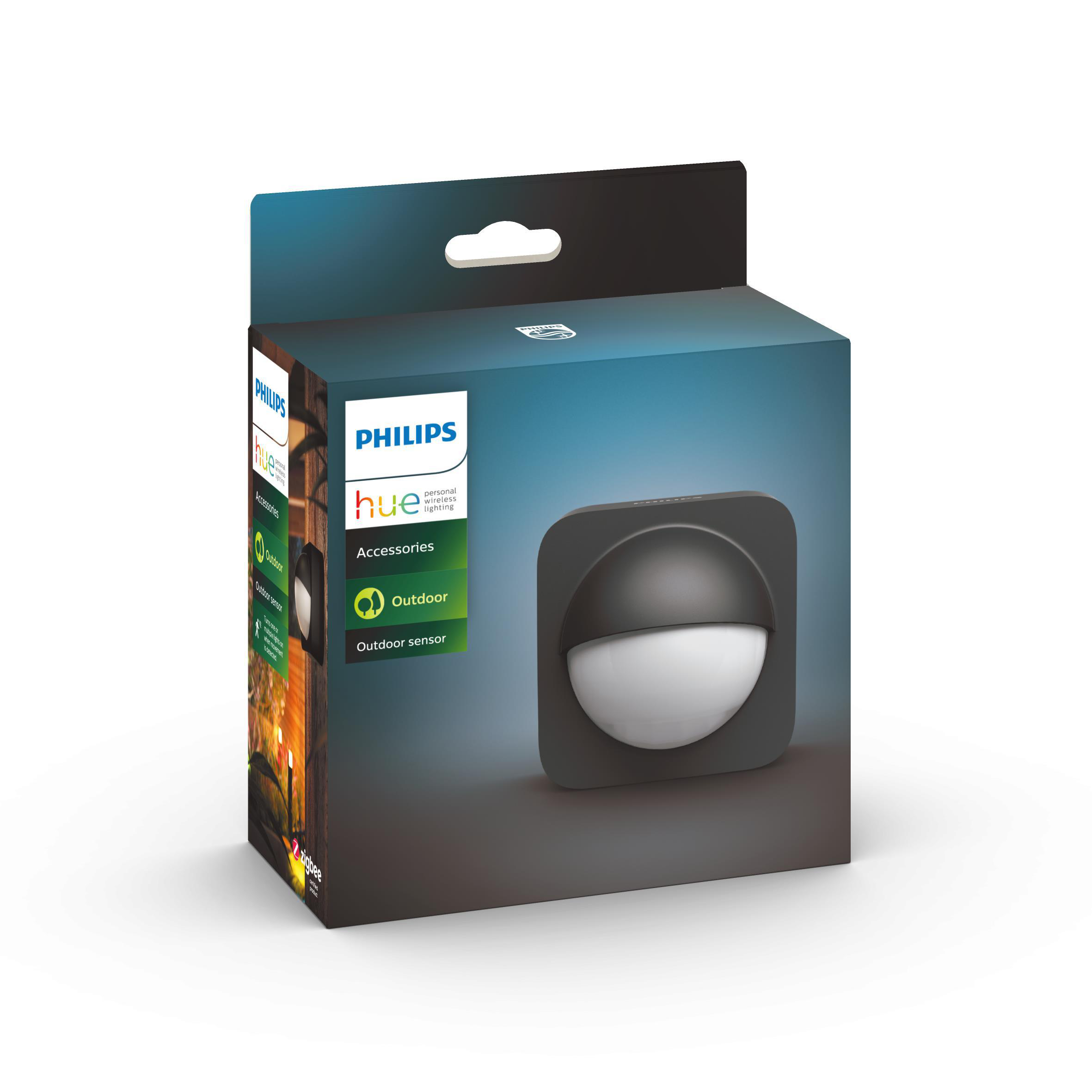 Ein Philips Hue Außensensor in seiner Box. Zeigt das Gerät und eine Gartenszene.