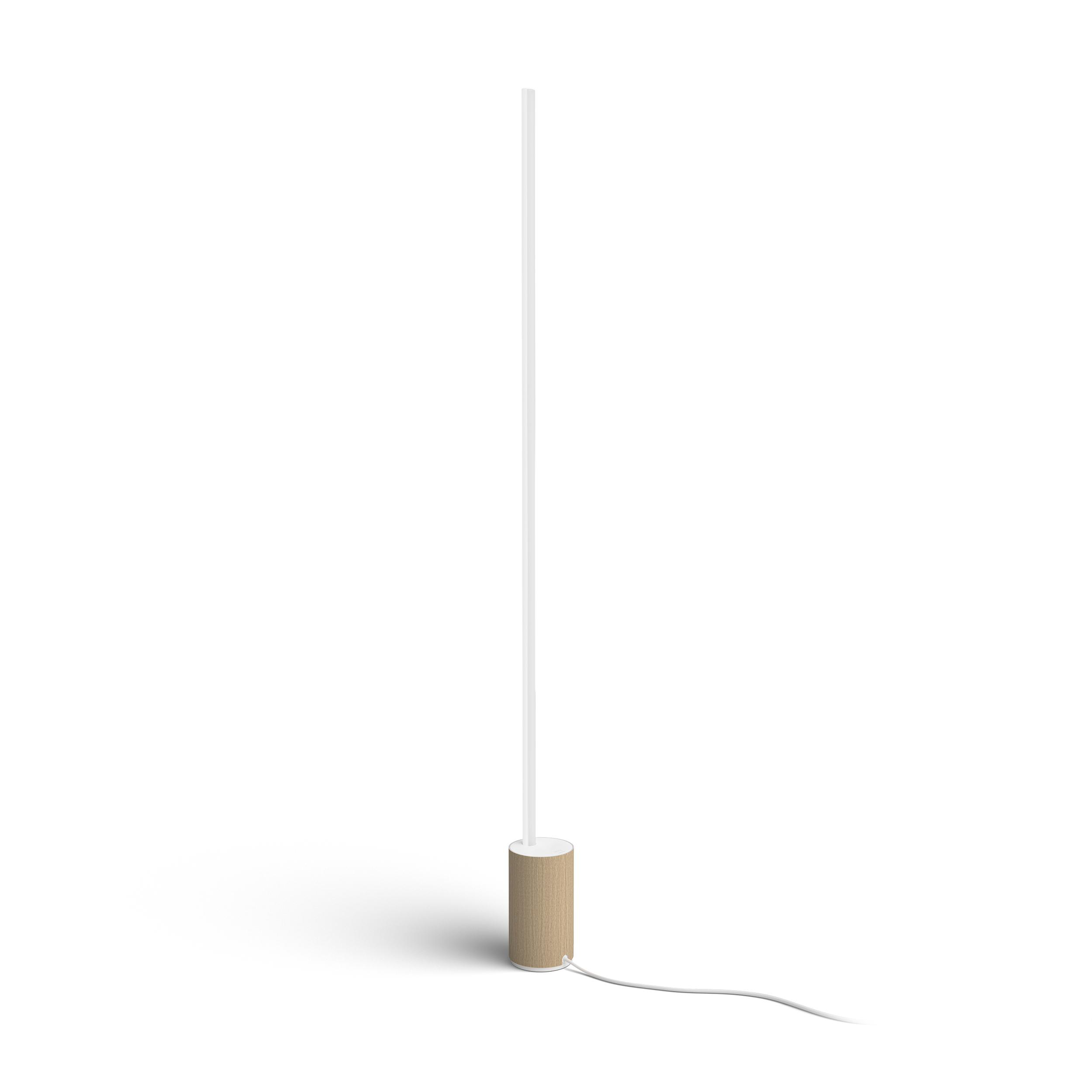 Hohe Stehlampe. Weißes Licht auf schlanker Stange, brauner Sockel, weißes Kabel.