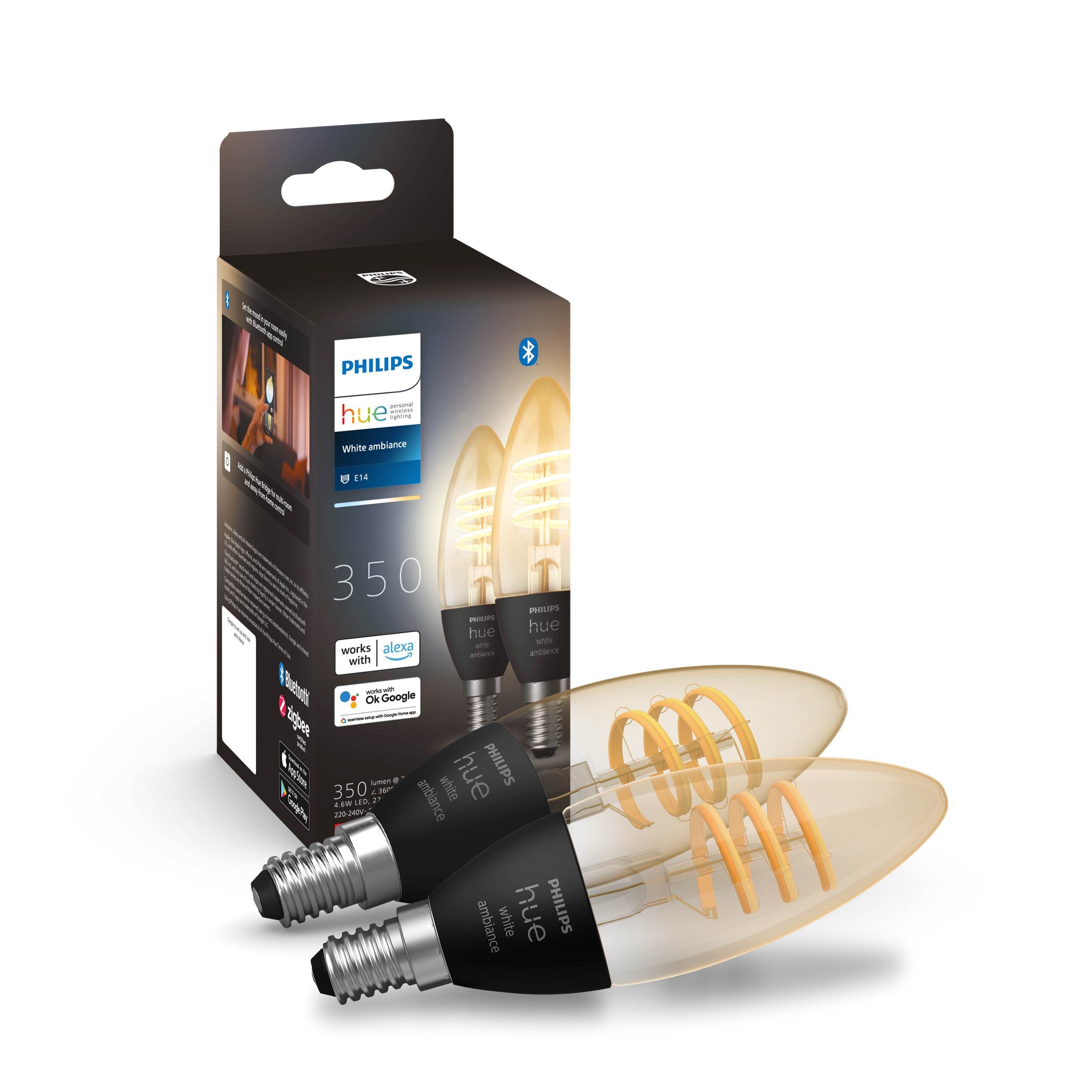 Zwei Glühbirnen und eine Schachtel. Die Glühbirnen sind bernsteinfarben mit Wendel. Auf der Box steht Philips Hue white ambiance.