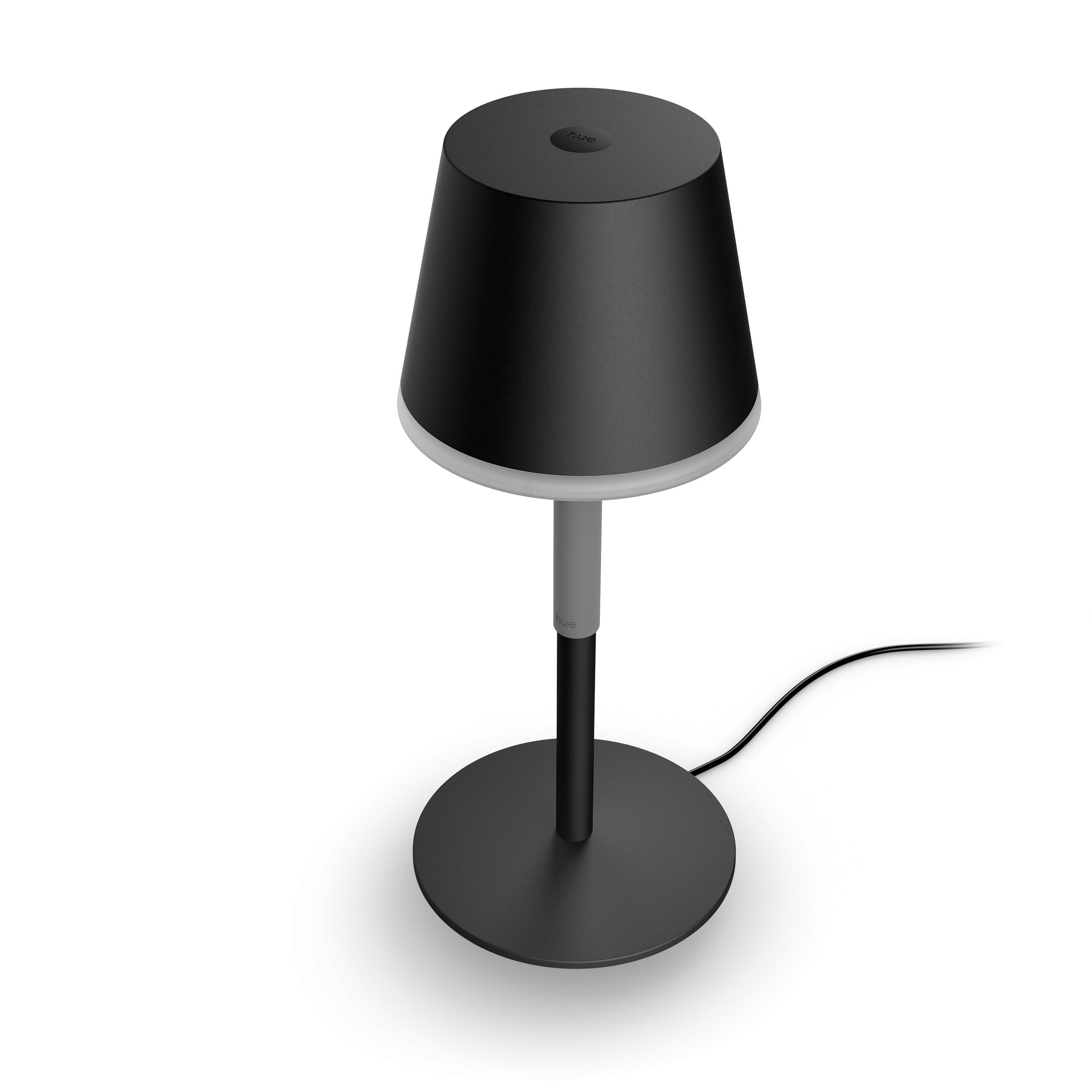 Eine schwarze Tischlampe mit rundem Sockel und Lampenschirm.