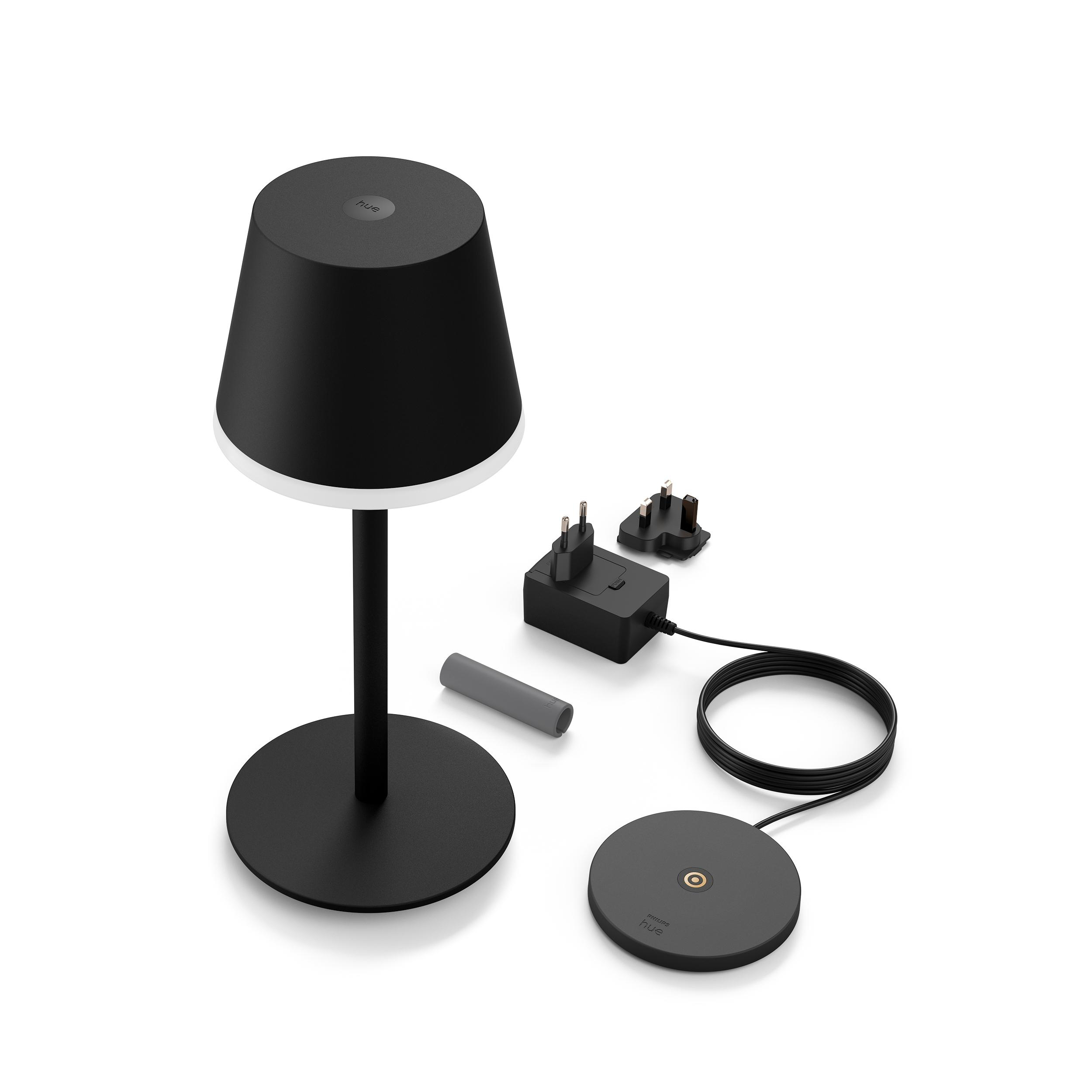 Schwarze Tischlampe mit schwarzem Schirm und weißem Rand. Enthält ein Ladegerät und eine Basis.