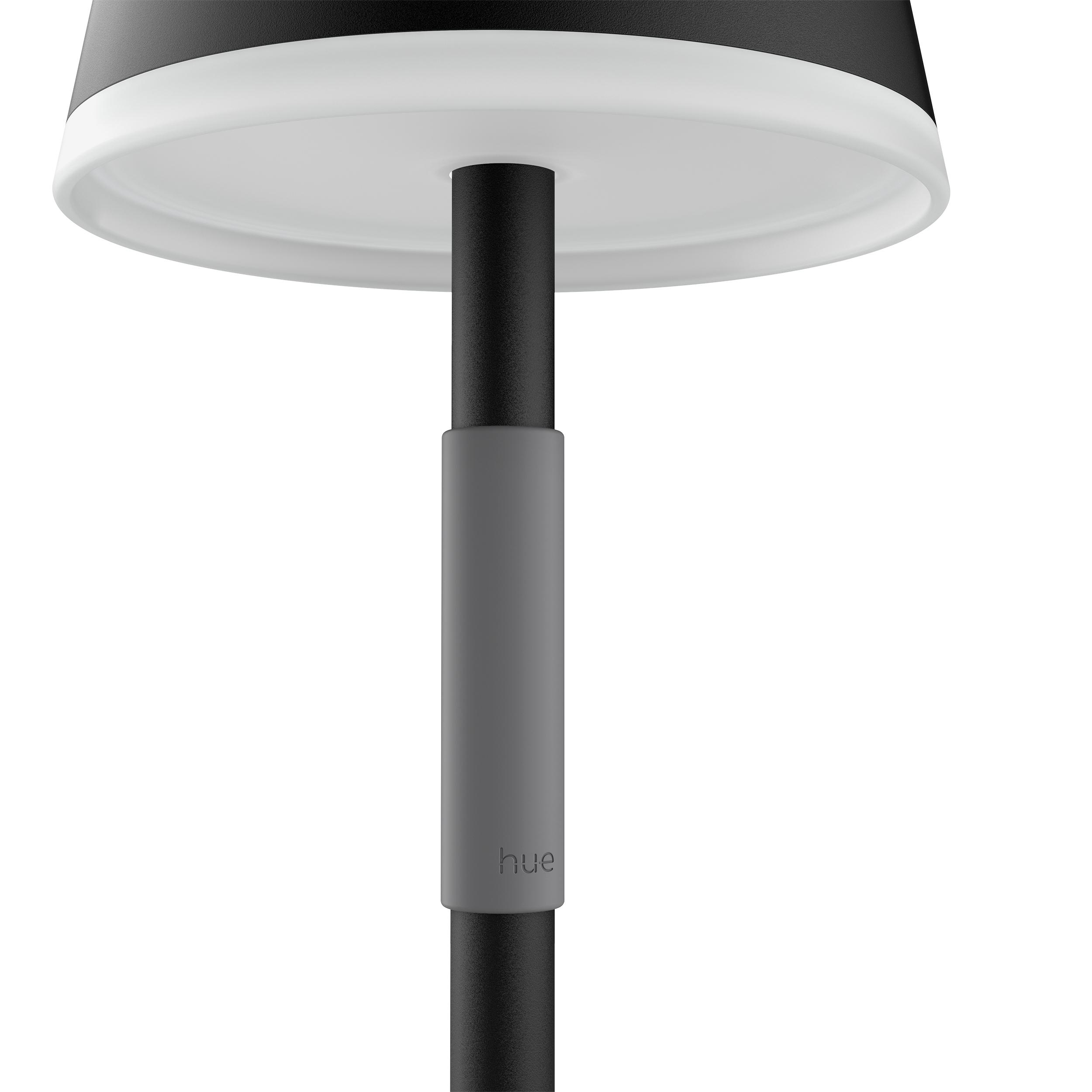 Nahaufnahme einer schwarz-weißen Lampe, die den Stiel und den Lampenschirm zeigt.