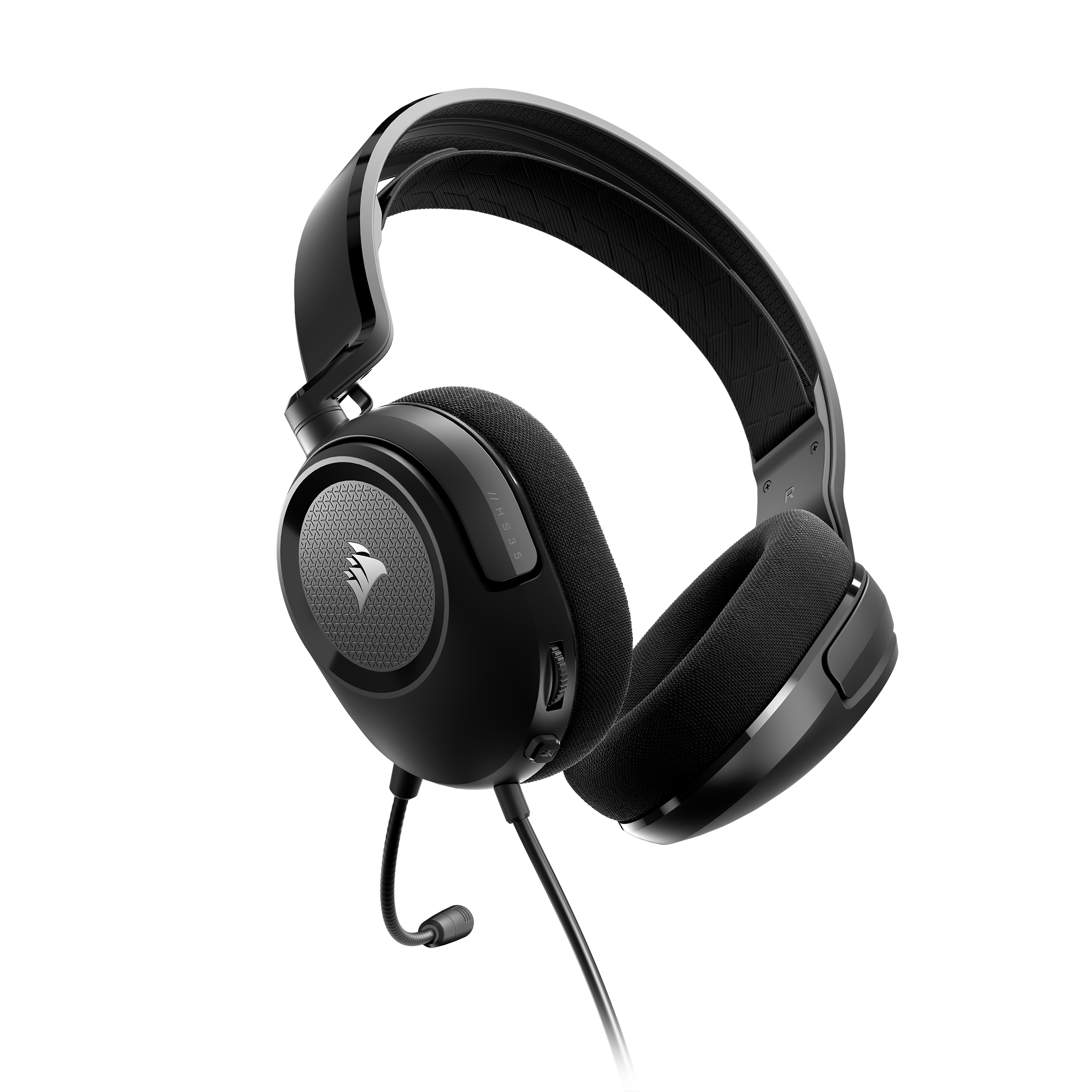 Auriculares Corsair negros con micrófono, sobre un fondo negro.